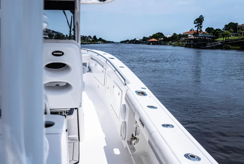  Yacht Photos Pics 2018 Everglades 435 Center Console boat cruising on a scenic river.