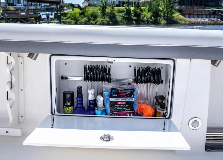  Yacht Photos Pics Storage compartment on 2018 Everglades 435 Center Console boat, stocked with fishing gear.