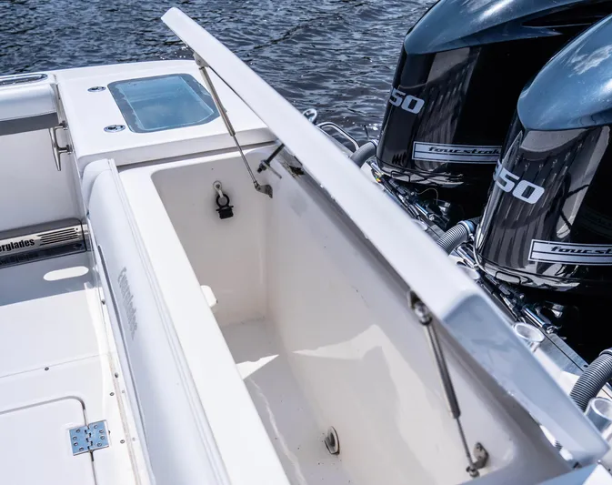  Yacht Photos Pics 2018 Everglades 435 Center Console boat with open storage and twin outboard engines.