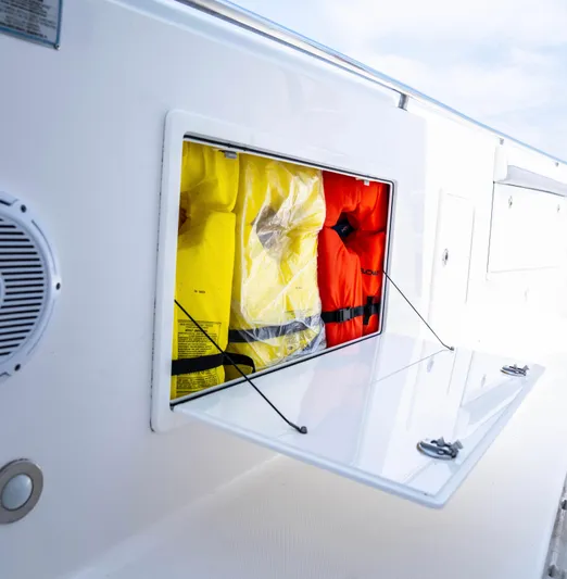  Yacht Photos Pics 2018 Everglades 435 Center Console with life jackets in storage compartment.