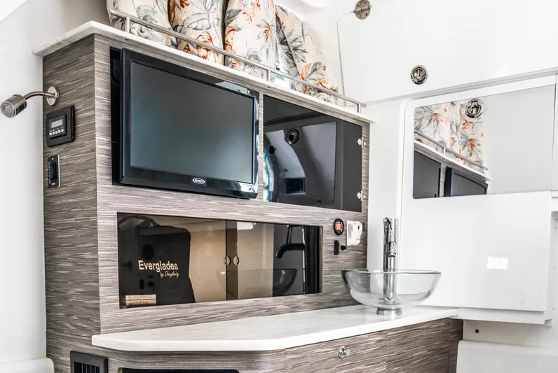  Yacht Photos Pics Interior of 2018 Everglades 435 Center Console with TV, sink, and modern cabinetry.