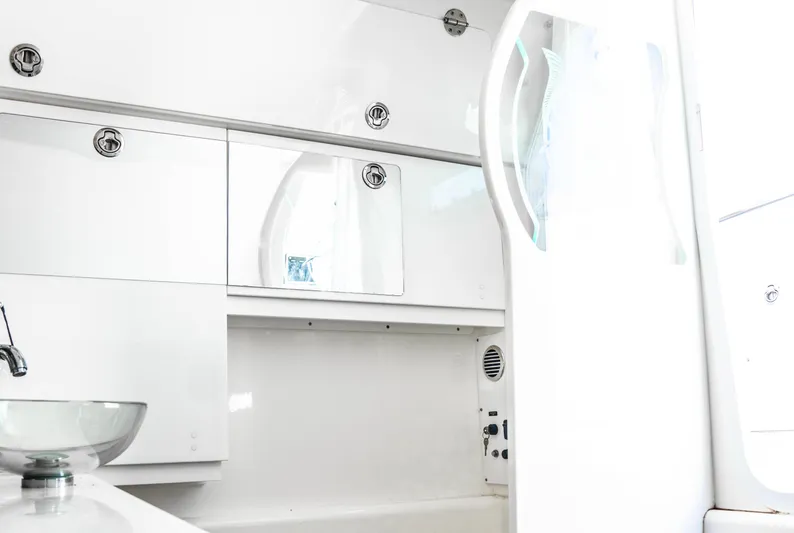  Yacht Photos Pics Interior of 2018 Everglades 435 Center Console boat, featuring sleek white cabinetry.