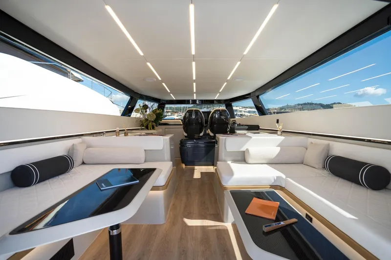 R2d2 Yacht Photos Pics Luxurious interior of 2025 Sunreef 55 Ultima yacht with modern seating and panoramic windows.