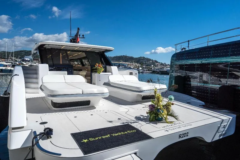R2d2 Yacht Photos Pics Luxury Sunreef 55 Ultima yacht, 2025 model, docked with elegant sunbathing area.