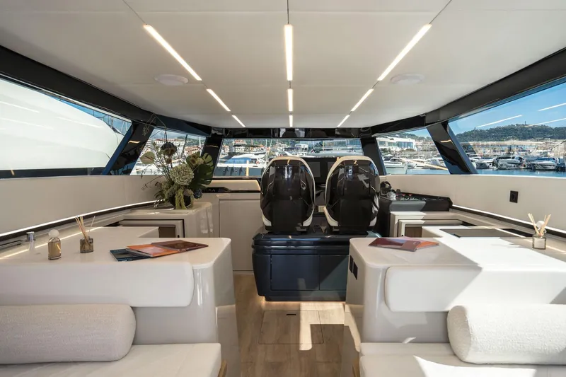 R2d2 Yacht Photos Pics Luxurious interior of 2025 Sunreef 55 Ultima yacht with modern seating and panoramic windows.