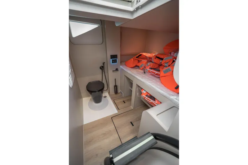 R2d2 Yacht Photos Pics Modern bathroom and storage area on 2025 Sunreef 55 Ultima yacht with life jackets.