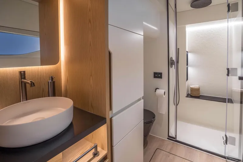 R2d2 Yacht Photos Pics Luxurious bathroom in 2025 Sunreef 55 Ultima yacht, featuring modern fixtures and elegant design.