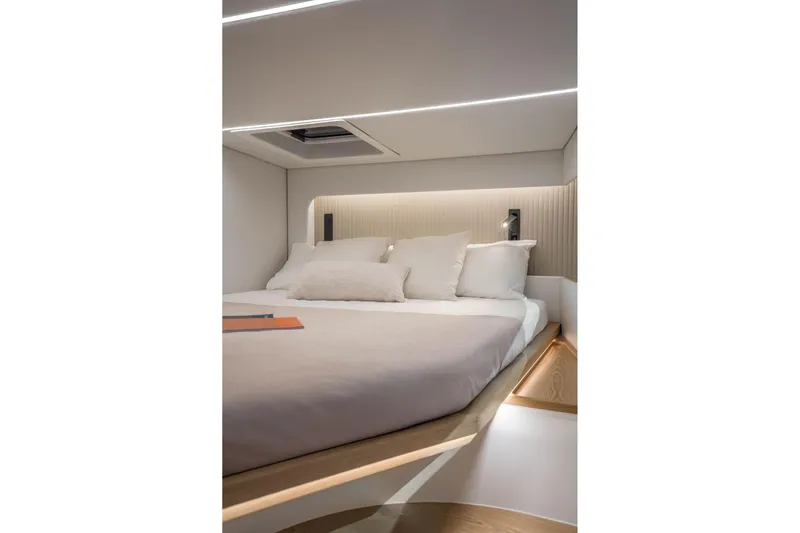 R2d2 Yacht Photos Pics Luxurious bedroom interior of 2025 Sunreef 55 Ultima yacht with modern design and ambient lighting.