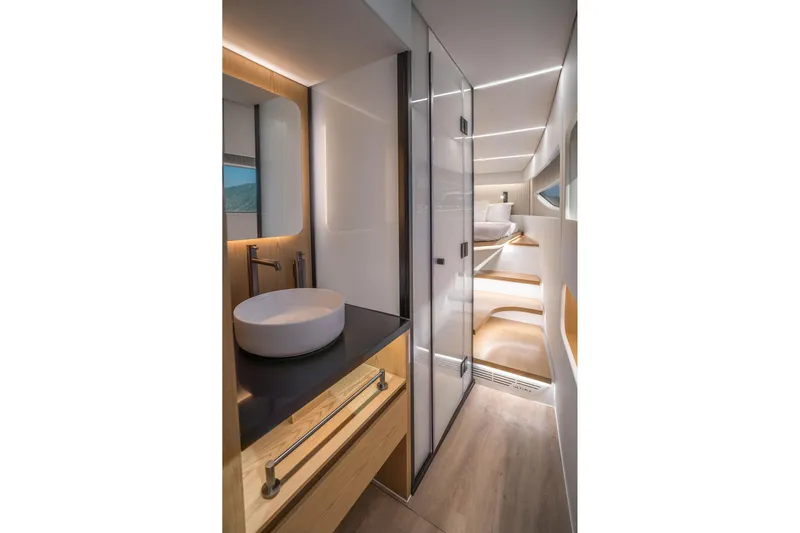 R2d2 Yacht Photos Pics Luxurious interior of 2025 Sunreef 55 Ultima yacht, featuring modern bathroom and cozy cabin.