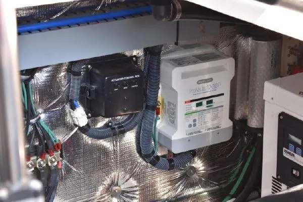  Yacht Photos Pics Engine compartment of a 2015 Regal 32 Express boat, featuring electrical components and wiring.