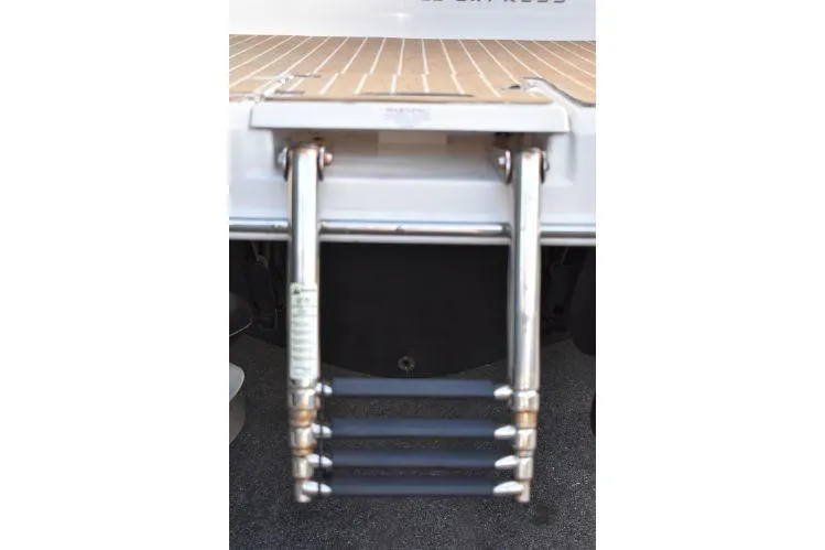  Yacht Photos Pics Stainless steel swim ladder on 2015 Regal 32 Express boat.