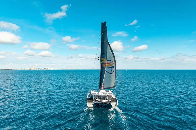 Crux Yacht Photos Pics Sailing yacht Harvey Yachts 58, 2017 model, cruising on open blue sea under clear skies.
