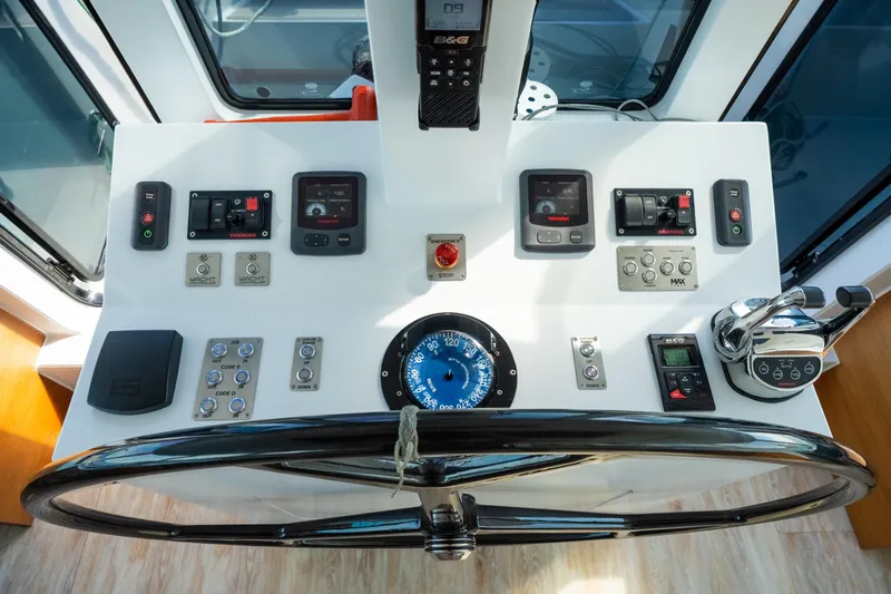 Crux Yacht Photos Pics Helm of 2017 Harvey Yachts 58 with navigation controls and steering wheel.