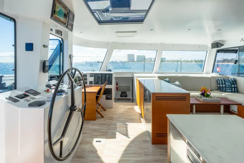 Crux Yacht Photos Pics Luxurious interior of 2017 Harvey Yachts 58, featuring spacious helm and elegant seating area.