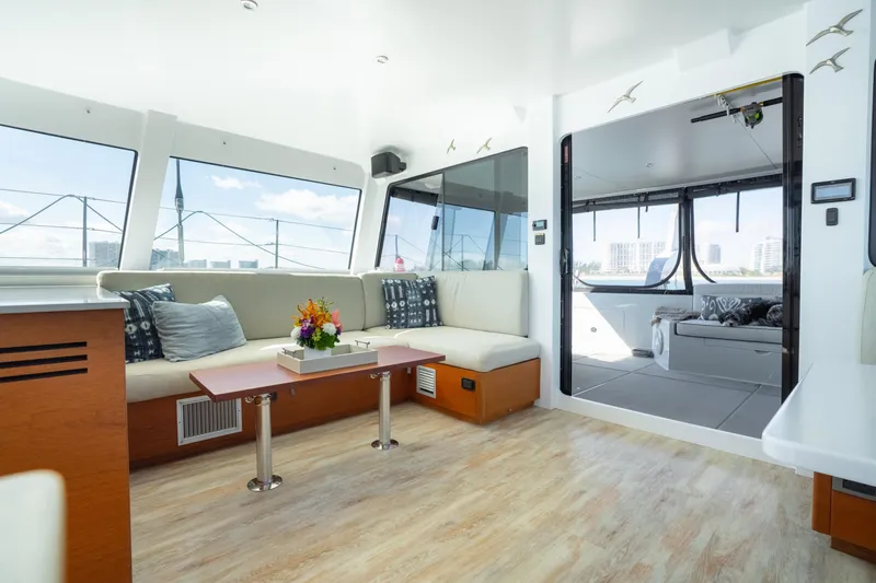 Crux Yacht Photos Pics Luxurious interior of 2017 Harvey Yachts 58, featuring elegant seating and modern design.