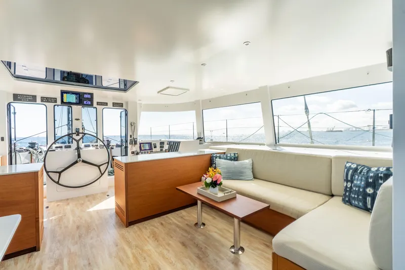 Crux Yacht Photos Pics Luxurious interior of 2017 Harvey Yachts 58, featuring spacious seating and modern helm.