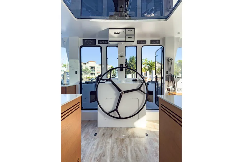 Crux Yacht Photos Pics Helm of 2017 Harvey Yachts 58, featuring modern navigation equipment and spacious interior design.