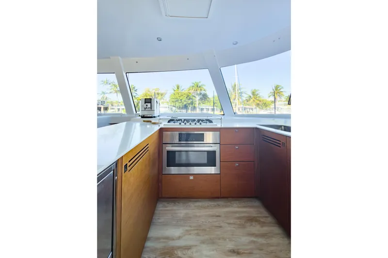 Crux Yacht Photos Pics Modern kitchen interior on 2017 Harvey Yachts 58, featuring sleek appliances and ocean view.