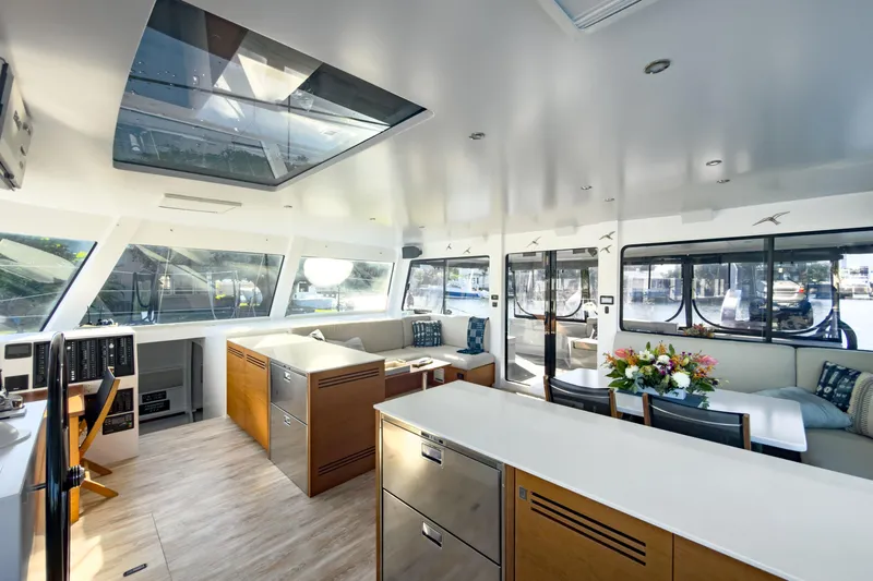 Crux Yacht Photos Pics Luxurious interior of 2017 Harvey Yachts 58, featuring modern design and spacious seating area.
