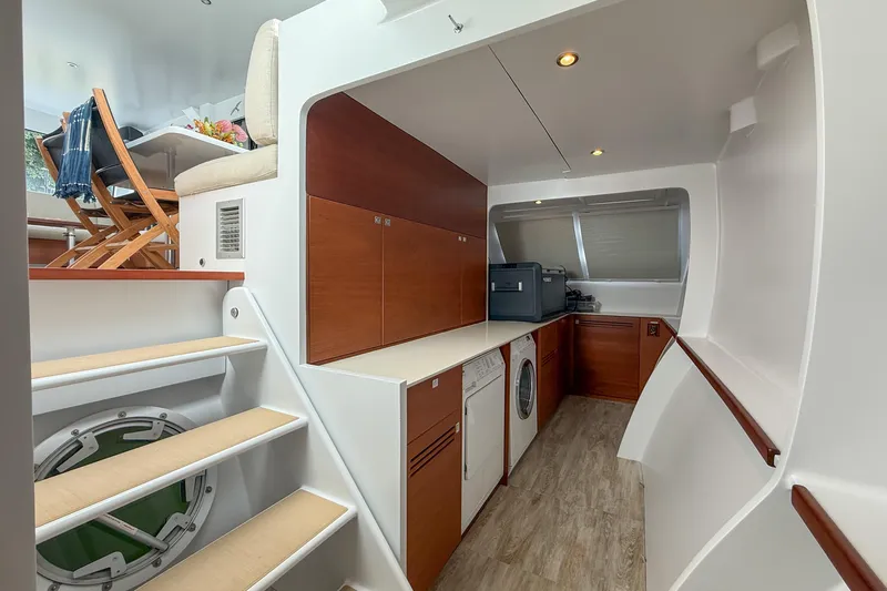 Crux Yacht Photos Pics Luxurious interior of 2017 Harvey Yachts 58, featuring modern kitchen and dining area.