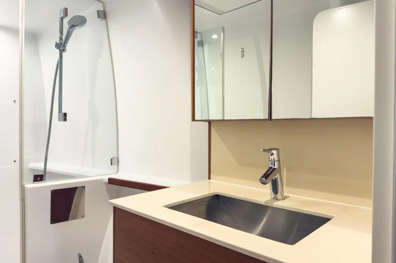 Crux Yacht Photos Pics Luxurious bathroom in 2017 Harvey Yachts 58, featuring modern sink and shower design.