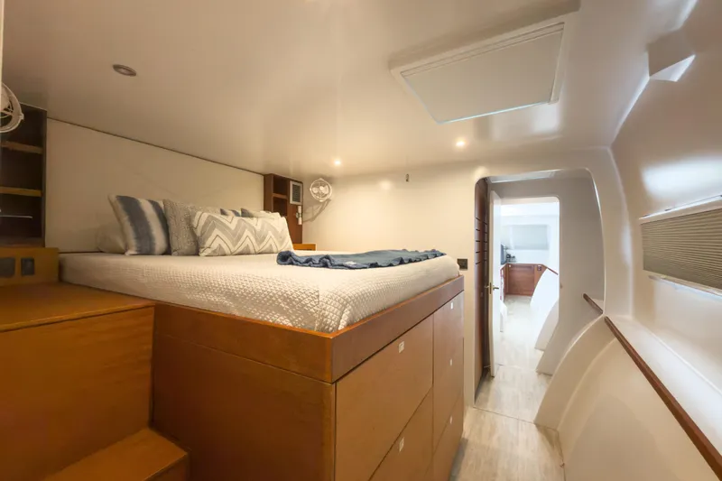 Crux Yacht Photos Pics Luxurious cabin interior of 2017 Harvey Yachts 58, featuring a cozy bed and modern design.