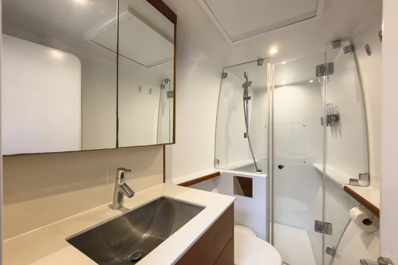 Crux Yacht Photos Pics Luxurious bathroom in 2017 Harvey Yachts 58, featuring modern fixtures and glass shower.