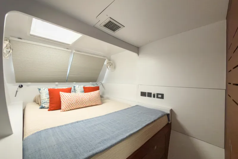 Crux Yacht Photos Pics Luxurious cabin interior of 2017 Harvey Yachts 58 with cozy bedding and modern design.