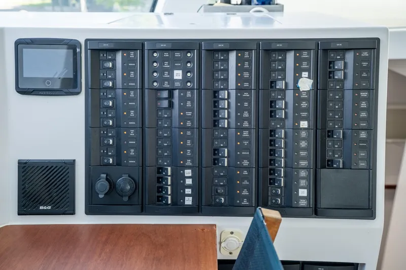 Crux Yacht Photos Pics Control panel of a 2017 Harvey Yachts 58, featuring various switches and displays.