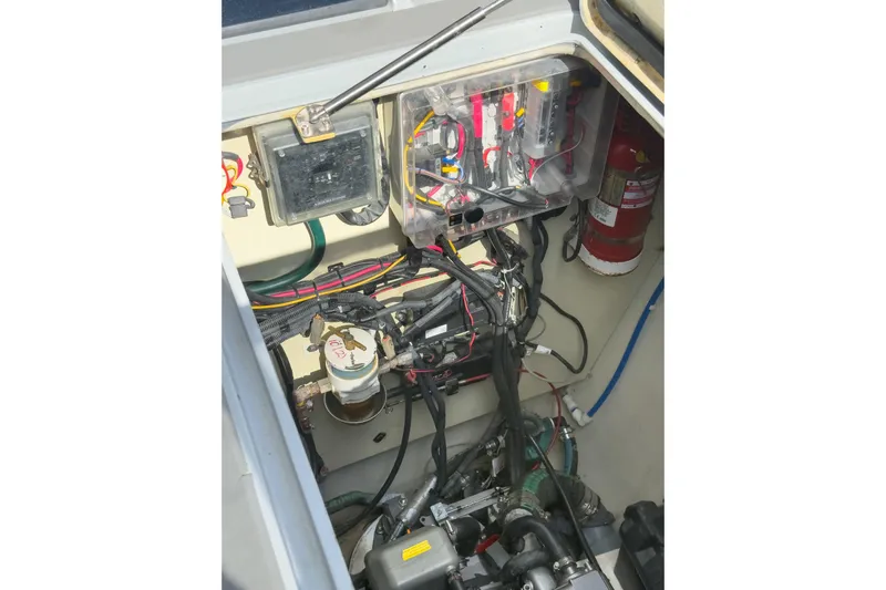 Crux Yacht Photos Pics Engine compartment of a 2017 Harvey Yachts 58, showcasing wiring and fire extinguisher.