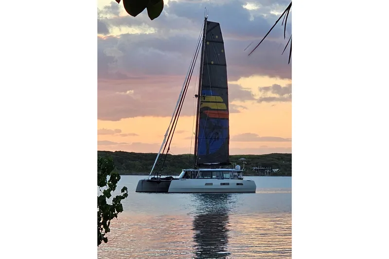 Crux Yacht Photos Pics Sailing yacht Harvey Yachts 58, 2017 model, at sunset on calm waters.