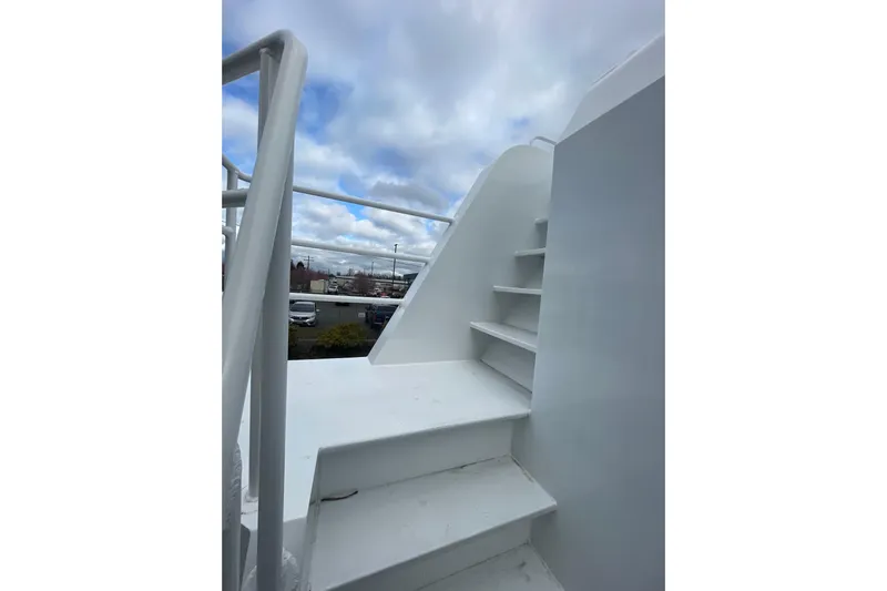  Yacht Photos Pics Staircase on 2025 Houseboat ALLHOUSE HB-1250 under a cloudy sky.