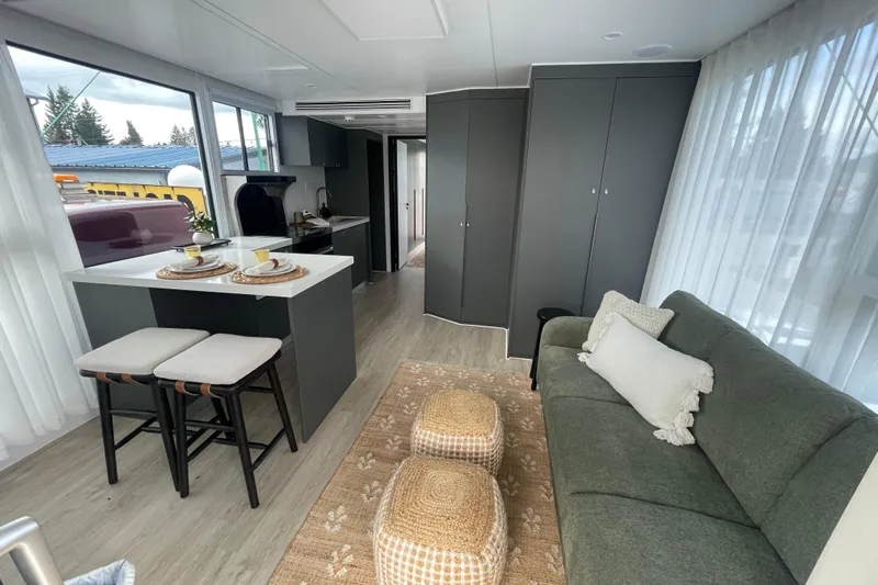  Yacht Photos Pics Modern 2025 Houseboat ALLHOUSE HB-1250 interior with cozy living area and kitchen.