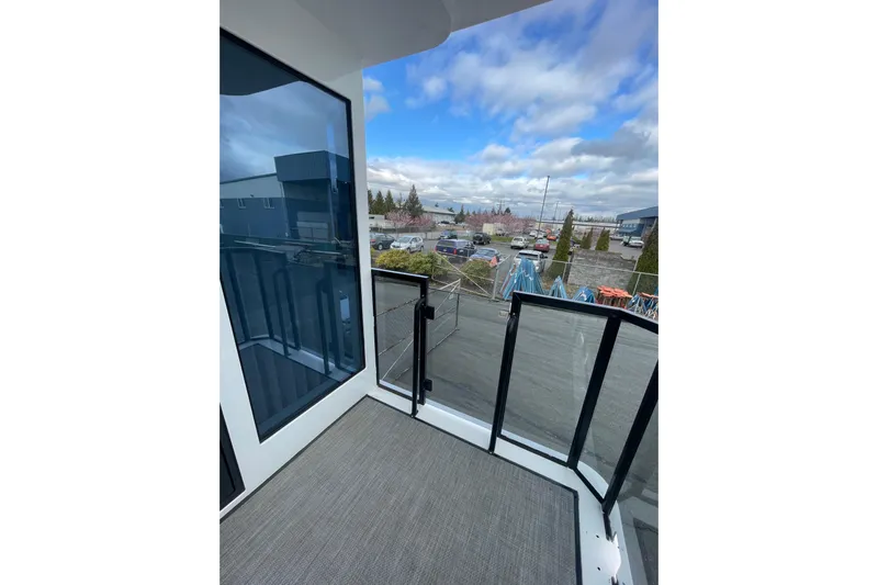  Yacht Photos Pics Modern balcony view from 2025 ALLHOUSE HB-1250 houseboat, showcasing sleek design and outdoor scenery.