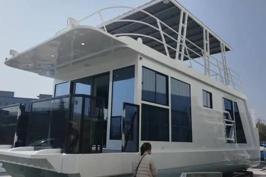  Yacht Photos Pics Modern 2025 custom houseboat with sleek design and spacious upper deck.