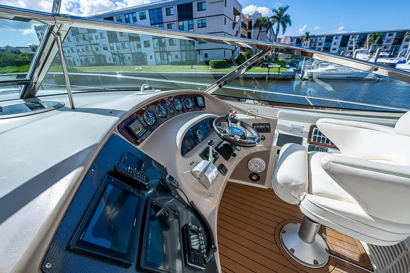 Nauti Buoy Yacht Photos Pics Luxurious 2002 Sea Ray 510 Sundancer yacht helm with modern controls and waterfront view.