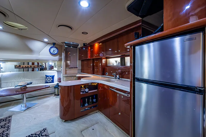 Nauti Buoy Yacht Photos Pics Luxurious interior of 2002 Sea Ray 510 Sundancer yacht with modern kitchen and seating area.