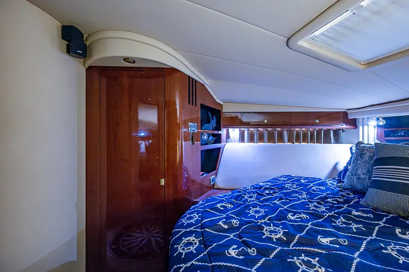 Nauti Buoy Yacht Photos Pics Luxurious cabin interior of 2002 Sea Ray 510 Sundancer yacht with nautical bedding.