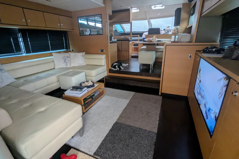  Yacht Photos Pics Luxurious interior of 2009 Fairline Squadron 55 yacht with modern furnishings and entertainment system.