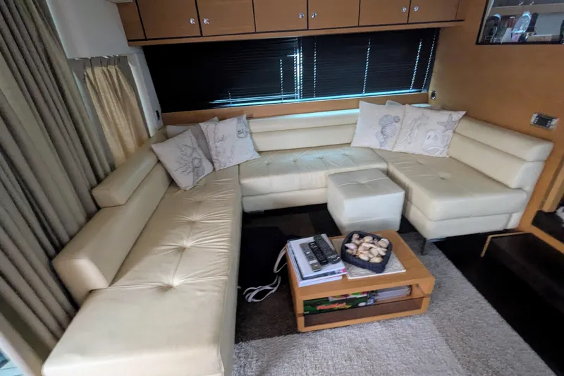  Yacht Photos Pics Luxurious interior of 2009 Fairline Squadron 55 yacht with cream leather seating and decorative pillows.