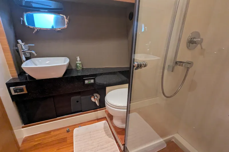  Yacht Photos Pics Luxurious bathroom in 2009 Fairline Squadron 55 yacht with modern fixtures and shower.