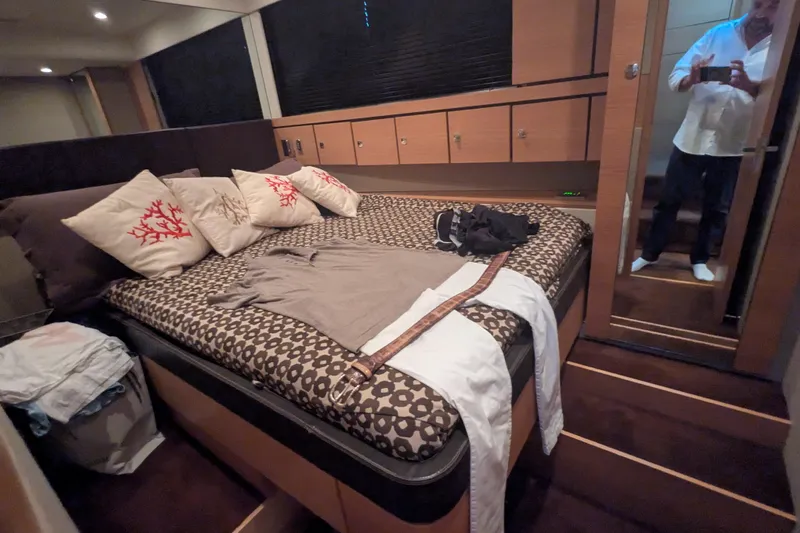  Yacht Photos Pics Luxurious bedroom interior of 2009 Fairline Squadron 55 yacht with stylish decor.