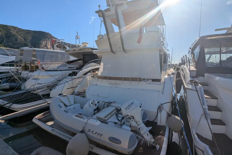  Yacht Photos Pics 2009 Fairline Squadron 55 yacht docked with inflatable boat and Suzuki motor.