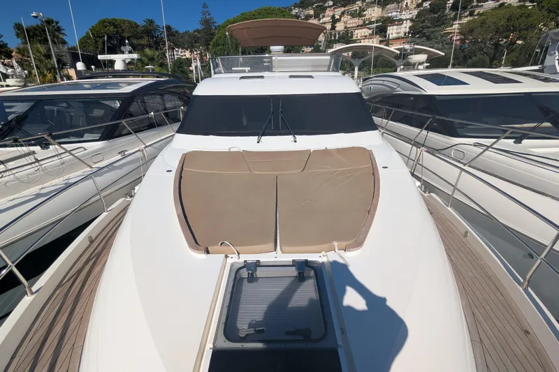  Yacht Photos Pics 2009 Fairline Squadron 55 yacht docked, featuring spacious deck and sunbathing area.