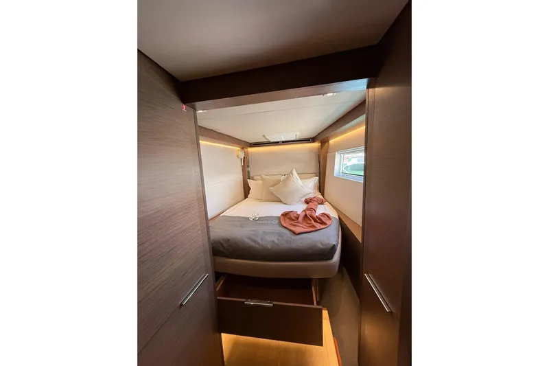  Yacht Photos Pics Cozy cabin interior of 2020 Lagoon 50 yacht with modern design and soft lighting.