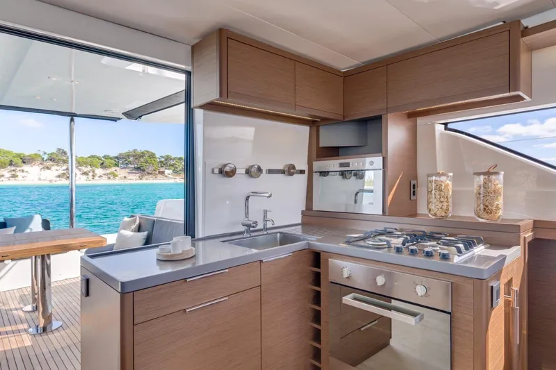  Yacht Photos Pics Modern kitchen interior on 2020 Lagoon 50 yacht with ocean view.