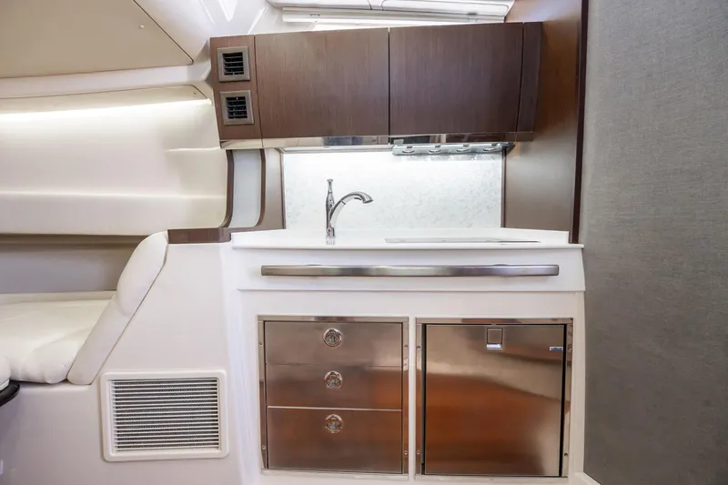 4 Reels Yacht Photos Pics Luxurious interior of 2021 Grady-White Canyon 456 boat with modern kitchenette.