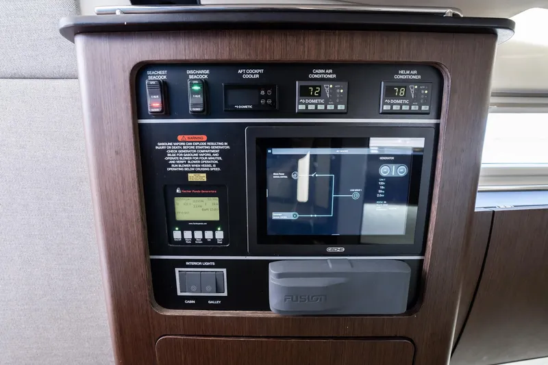 4 Reels Yacht Photos Pics Control panel of 2021 Grady-White Canyon 456 boat with air conditioning and generator settings.