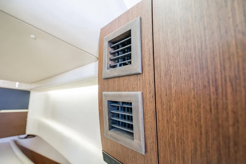 4 Reels Yacht Photos Pics Wooden interior detail of 2021 Grady-White Canyon 456 boat cabin.