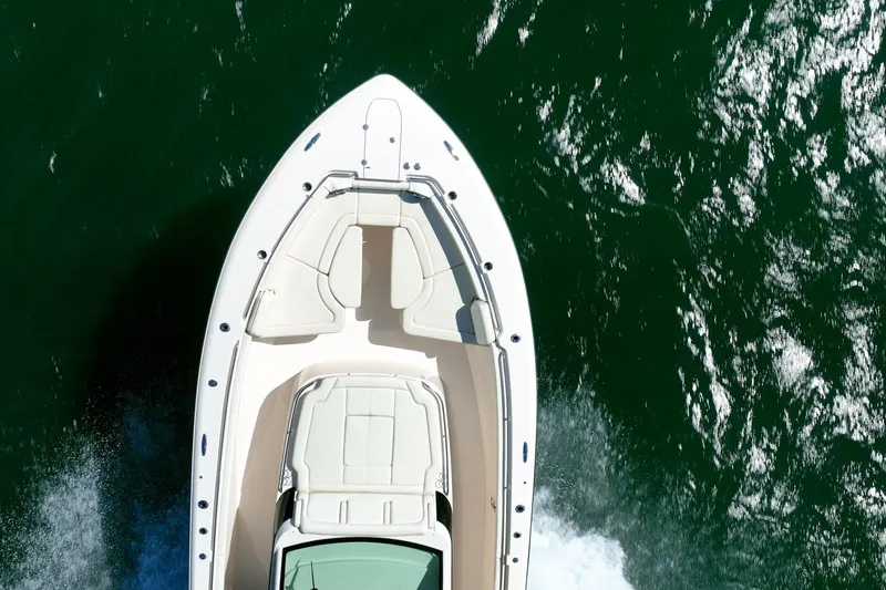 4 Reels Yacht Photos Pics Aerial view of 2021 Grady-White Canyon 456 boat cruising on water.